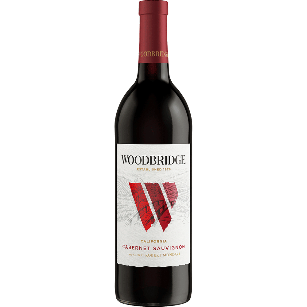 Woodbridge Cabernet Sauvignon bottle displayed on a wooden table at Sip N Burn Liquors, showcasing rich red color and elegant label design.